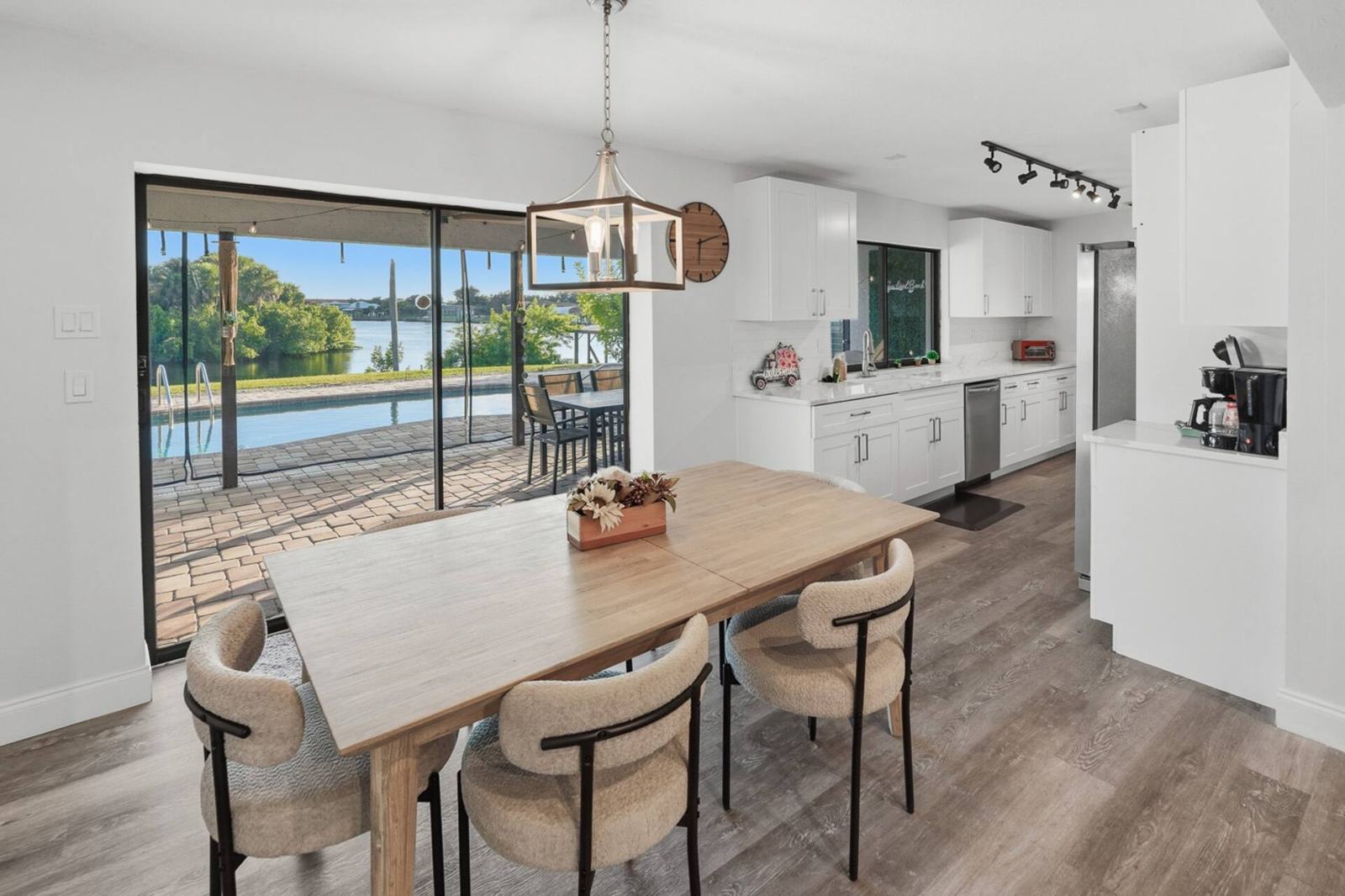 Dining table beside sliding doors to the water